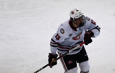 Calgary Flames centre Tyson Gross skates with St. Cloud State